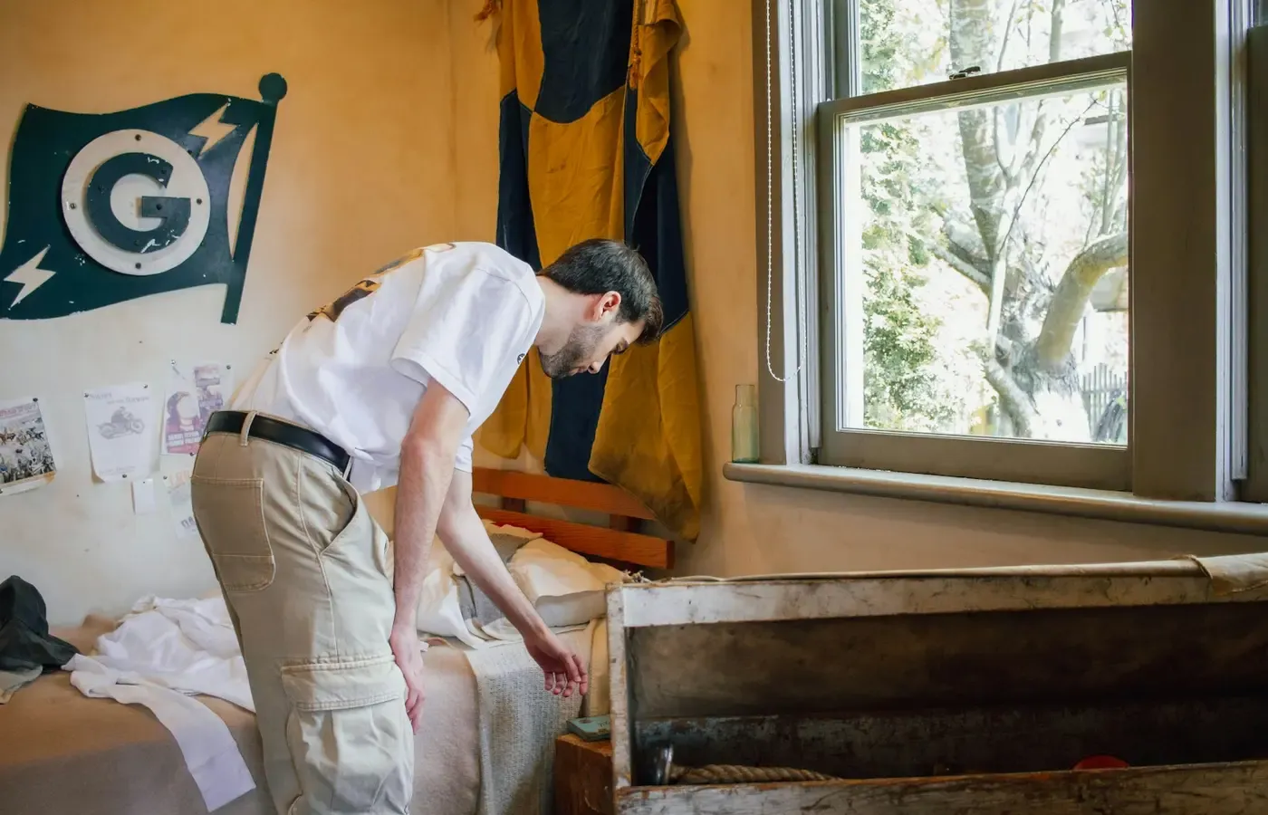 Person inspecting a used sofa