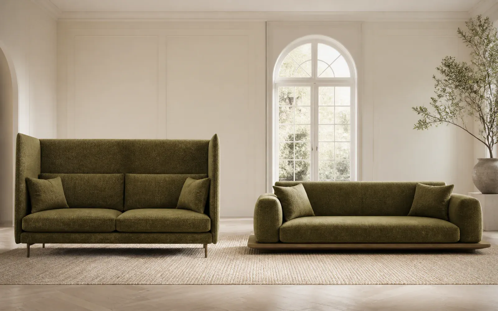 A high-back sofa and a low-profile sofa shown side by side in the same airy living room